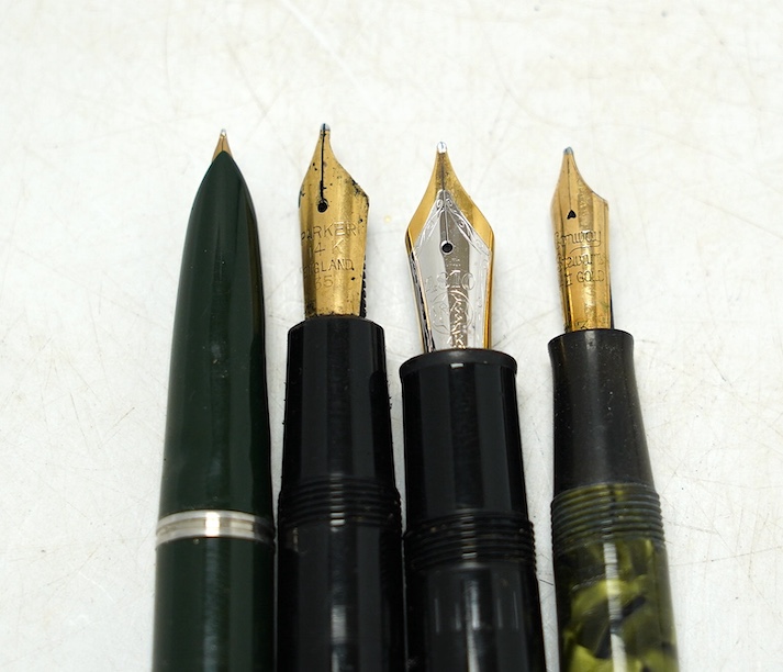 A Montblanc fountain pen with 14k gold nib and three others comprising two Parker’s and a marbleised example